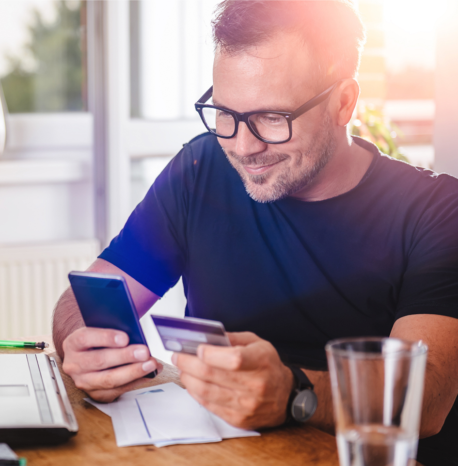 Man with credit card and cellphone